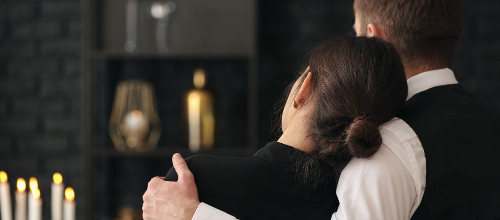 Grieving couple embracing in comfort